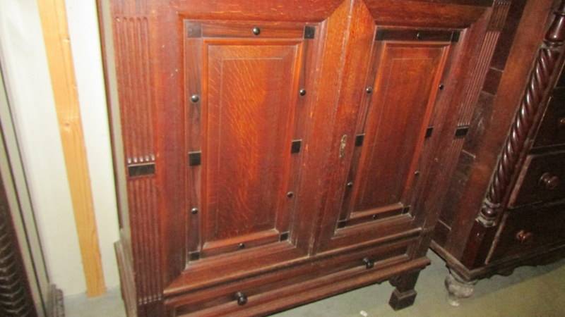 A Victorian dark oak cupboard with two drawers and two doors. (Collect only). - Image 3 of 3