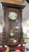 A mahogany wall clock. (Collect only).