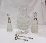 A good quality crystal glass jug, two perfume bottle with silver collars,