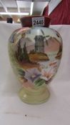 A Victorian hand painted glass vase.