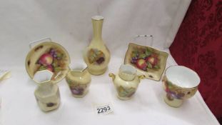 Seven pieces of Aynsley Orchard Gold china.