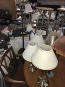 4 brushed brass table lamps and a floor standing standard lamp