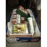 A large box of vintage toy farm building and accessories