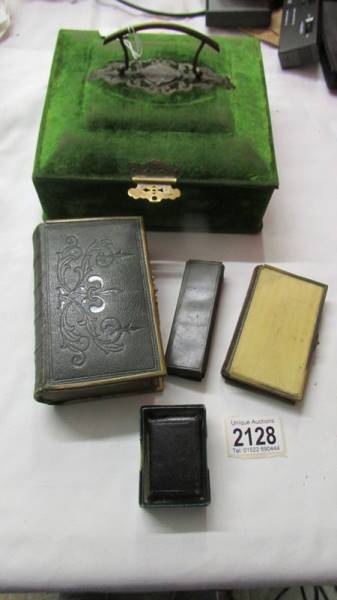 A Victorian velvet box with brass fittings containing two 19th century books of prayer,
