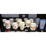 A quantity of commemorative royalty mugs etc