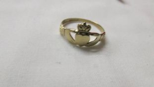 An Irish Claddagh ring which represents love, friendship and loyalty, size T.