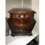 A dark wood stained magazine chest with cupboard