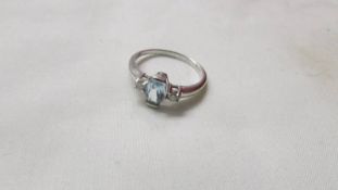 A 9ct white gold and diamond ring set with an oval blue topaz, size S.