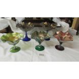 Five carnival glass sundae dishes including wreath & roses variant by Digon,