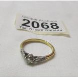 An 18ct gold and platinum diamond ring, size O, 2.3 grams.
