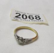 An 18ct gold and platinum diamond ring, size O, 2.3 grams.