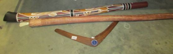 An original Aboriginal Queensland boomerang and two didgeridoo's.