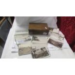 A wooden box of postcards including topographical, British etc.