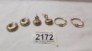 Three pairs of 9ct gold earrings, 8.3 grams.
