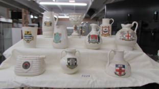 Ten large pieces of W H Goss crested china.