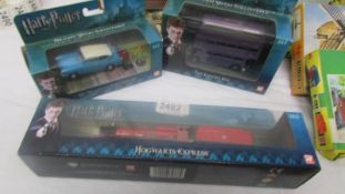 Three boxed Corgi Harry Potter die cast models including Ford Anglia.