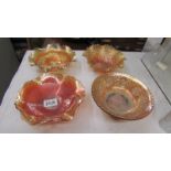 Four carnival glass marigold bowls - Imperial windmill, Fenton chrysanthemum,