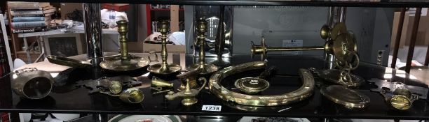 A quantity of brass items including horseshoe, candlesticks,