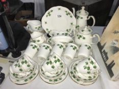 A Colclough ivy pattern tea set including tea and coffee pots plus bowls