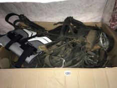 A large box of vintage horse leather straps