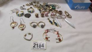 A mixed lot of earrings including some odds.