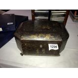 An Eastern tea caddy with 2 containers with lids, one lid missing knob and have some dents,