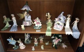 2 shelves of fairies etc
