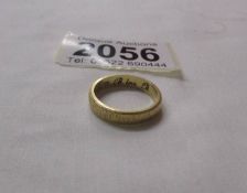 An 18ct gold wedding ring, size K half, 3.9 grams.