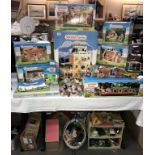 A huge collection of Sylvanian families boxed stables, school, bus, boutique, house etc,