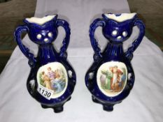 A pair of Edwardian era continental pottery vases