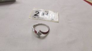 A18ct gold stylish four stone diamond ring, size M.