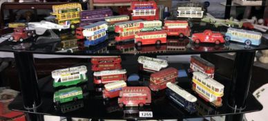 A good selection of unboxed dusty Lledo and Corgi classics buses and trams