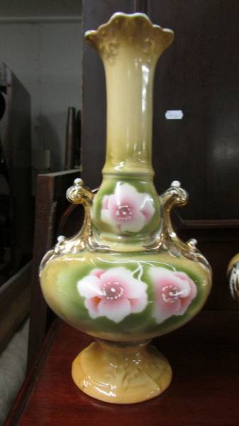 A pair of Staffordshire floral decorated vases. - Image 2 of 3