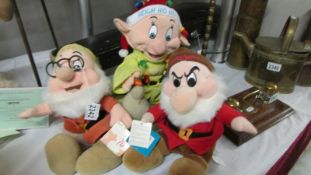 Three of Snow Whites dwarfs - Doc, Grumpy and Dopey.