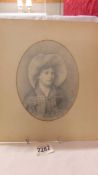 An oval pencil drawing of a lady signed Ellen Jowett.