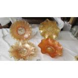 Four carnival glass marigold bowls - Fenton orange tree (bird & berry back), Fenton windflower,