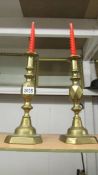 A pair of Victorian brass 'King of Diamond' candlesticks.