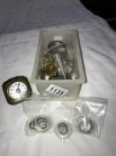 A small box of pocket and watch parts including lenses etc