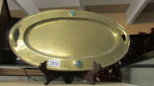 An oval arts and crafts brass tray.