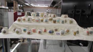 Forty pieces of W H Goss crested china.