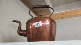 A Victorian copper kettle.