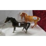 Two Beswick horses.