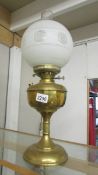 A brass oil lamp complete with shade and chimney. (collect only).