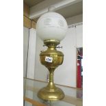 A brass oil lamp complete with shade and chimney. (collect only).