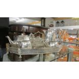 A four piece Walker and Hall silver plate tea set of an Sheffield plate gallery tray.