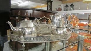 A four piece Walker and Hall silver plate tea set of an Sheffield plate gallery tray.