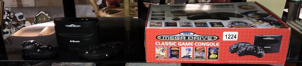 A boxed Mega Drive classic game console