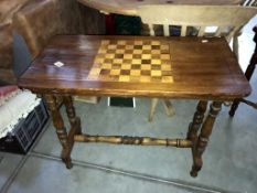 An Edwardian mahogany table with inlaid chess board top