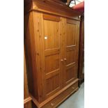 A good pine wardrobe with single drawer to base.