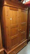 A good pine wardrobe with single drawer to base.